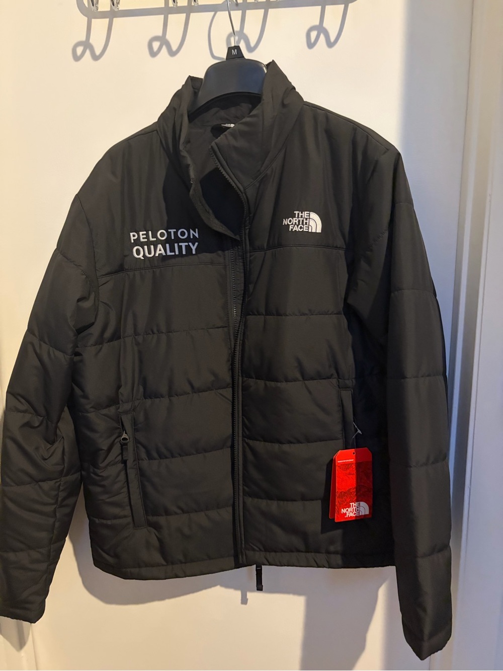 The North Face Men’s Black Quilted Puffer Jacket with Peloton Branding